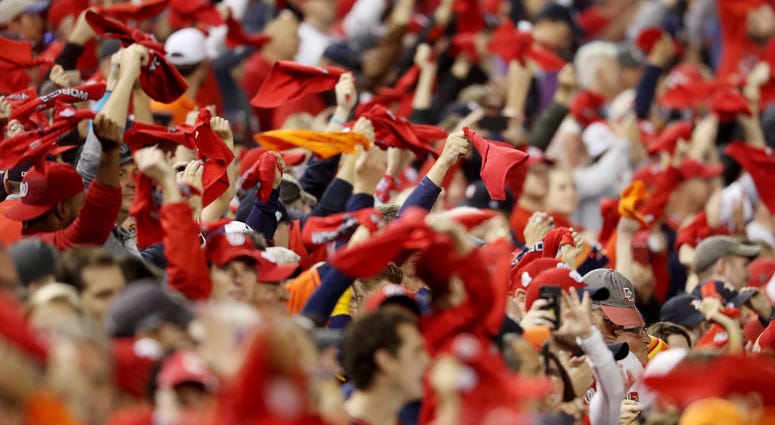 Nats fans wave towels to get fired up before Game 4. Fans cheer prior to Game Four of the 2019 World Series between the Houston Astros and the Nationals at Nats Park.