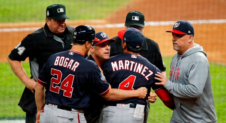 Dave Martinez needs to be held back by coaches. Best pictures of World Series umpire controversy, Dave Martinez ejection