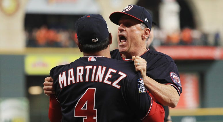 Chip Hale holds Dave Martinez back from the umpires. Best pictures of World Series umpire controversy, Dave Martinez ejection