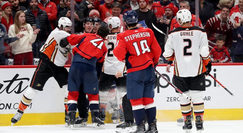 Caps' Garnet Hathaway spit on a Ducks player after a brawl. Erik Gudbranson of the Anaheim Ducks punches Garnet Hathaway of the Washington Capitals
