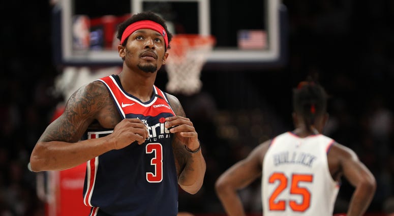 Wizards' Bradley Beal looks on against the New York Knicks during the first half at Capital One Arena. Bradley Beal trade murmurs continue as NBA sets to restart in Florida.