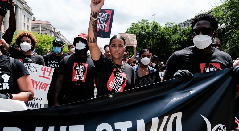 Natasha Cloud of the Washington Mystics marches to the MLK Memorial to support Black Lives Matter DC's Juneteenth march to the Martin Luther King, Jr. Memorial