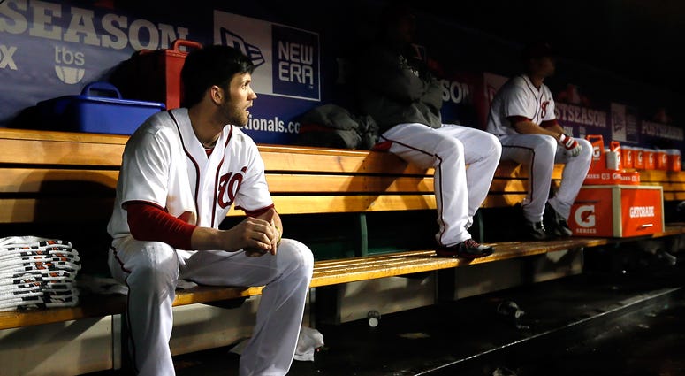 Harper sits dejected in the Nationals dugouts after a 9-7 Game 5 loss to the Cardinals in the 2012 NLDS. Hours later, the 19-year-old rookie would fire off a tweet, professing his love for D.C. Bryce Harper already calling Philly 'the greatest city in the world'