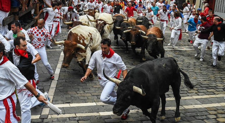 Fighting bulls enter Estafeta at the Running of the Bulls. Redskins CB Josh Norman goes to Pamplona and the running of the bulls.