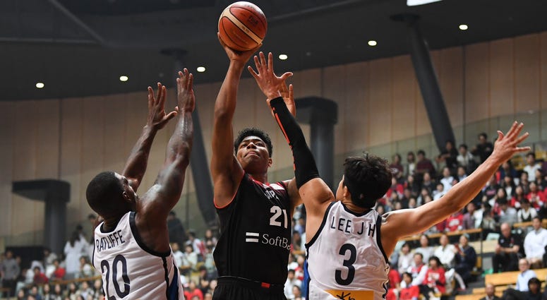Rui Hachimura shoots over two defenders during the Japan-South Korea - Basketball International Game in Tokyo on June 15, 2018 Rui Hachimura shoots over two defenders during the Japan-South Korea - Basketball International Game in Tokyo on June 15, 2018