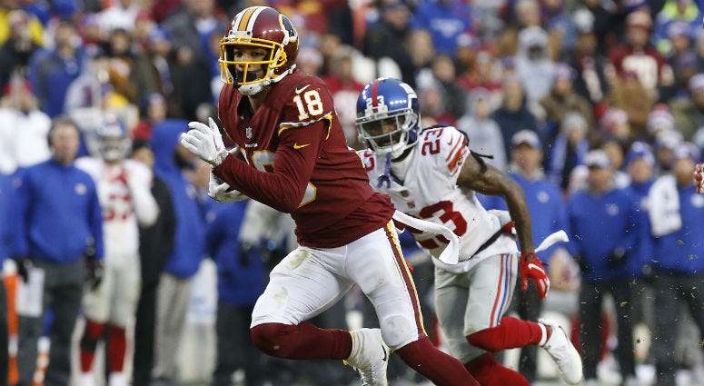Question 6: Who wins position battle at wide receiver? Redskins WR Josh Doctson runs with the ball against the Giants.