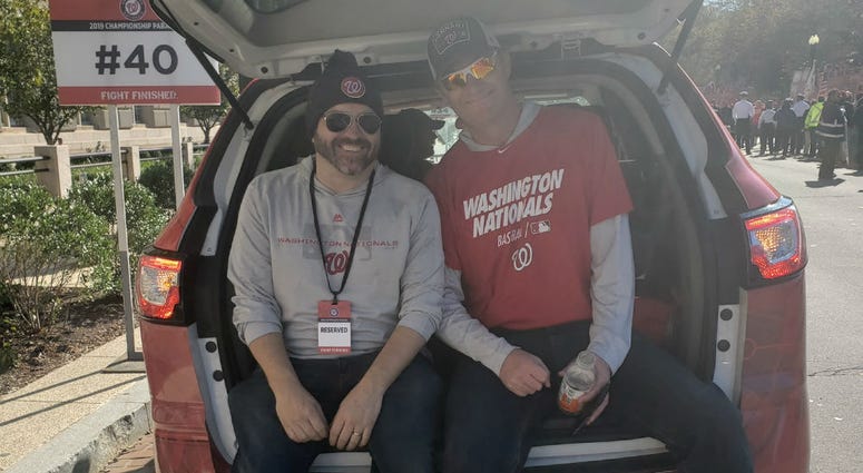Cakes and Bish just chillin' in the back of a station vehicle before the Nationals parade. The Sports Junkies of WJFK-FM take part in the Washington Nationals victory parade in Washington, D.C. on Saturday, November 1.