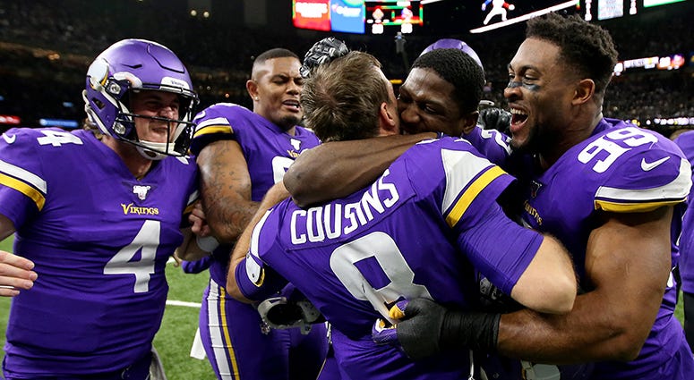Kirk Cousins celebrates with Vikings teammates after throwing the game-winning touchdown in overtime to beat the Saints Kirk Cousins lobs fade pass for OT win
