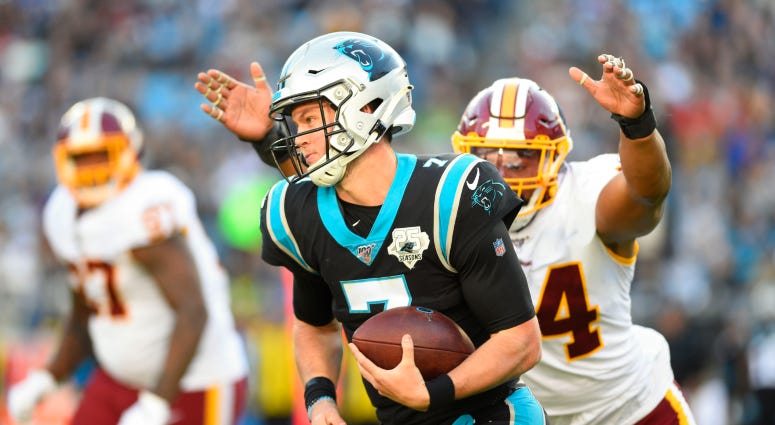 Kyle Allen pursued by Redskins linebacker Myles Humphrey in the fourth quarter of a Week 13 game. Redskins acquire QB Kyle Allen in trade with Panthers