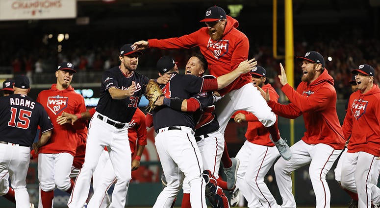 The Nationals rush the field after beating the Cardinals 7-4 in Game 4 of the NLCS Nationals Celebrate World Series Berth