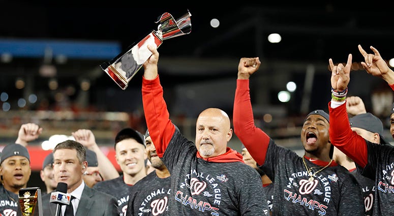 Nats GM Mike Rizzo hoists the NLCS trophy Nats GM Mike Rizzo