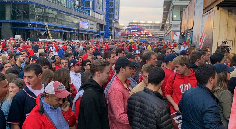 Baseball fans line Half Street before Game 3 of the World Series, Friday night in D.C. Baseball fans line Half Street before Game 3 of the World Series, Friday night in D.C.