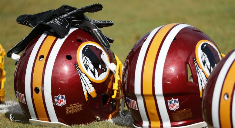 With 10 days to go until training camp, The Fan started asking our 10 biggest questions about the 2019 Washington Redskins. Redskins helmets sit on the field prior to practice.