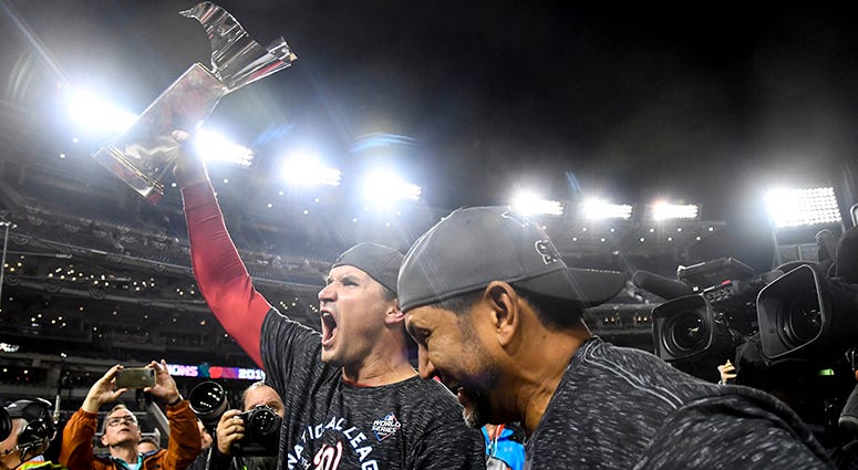 Ryan Zimmerman hoists the NLCS trophy Ryan Zimmerman