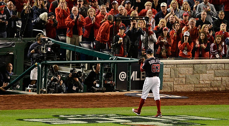 Sean Doolittle walks off the field after holding the 7-4 lead over 1.2 innings in Game 4 of the NLCS Sean Doolittle NLCS Game 4