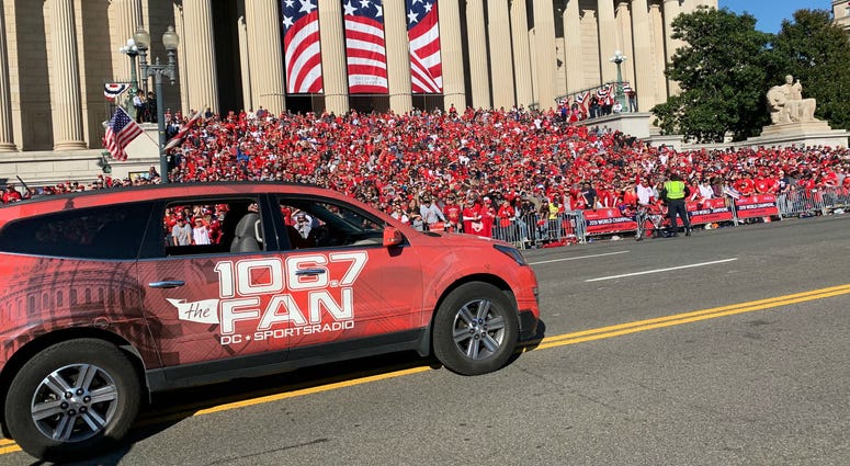 It was a big day for 106.7 The Fan and its personalities at the Nationals victory parade. A 106.7 The Fan station vehicle drives through the Washington Nationals parade on Saturday, November 1.