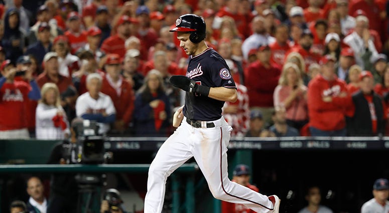 Trea Turner scores on a Rendon sacrifice fly for the first run of Game 4, the first of a seven-run onslaught by the Nats in the first inning Trea Turner Scores
