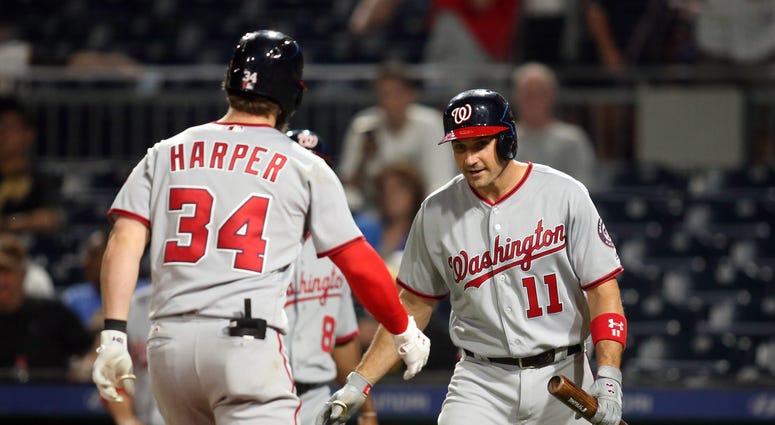 Bryce Harper and Ryan Zimmerman high five after a Harper home run. Bryce_Harper_Ryan_Zimmerman