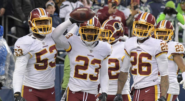 DeAngelo Hall celebrates with Redskins teammates after breaking up a pass in a 2017 win over the Seahawks. Had the Redskins hired Hall to coach their defensive backs in 2019, he would have been leading half the players on this photo. Redskins seriously considered DeAngelo Hall to coach DBs