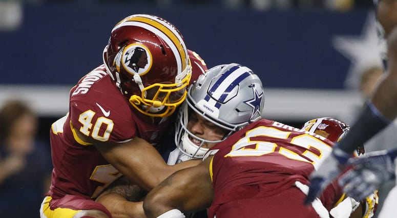 Josh Harvey-Clemons and Zach Brown sack Dak Prescott Zach_Brown_sacks_Dak_Prescott