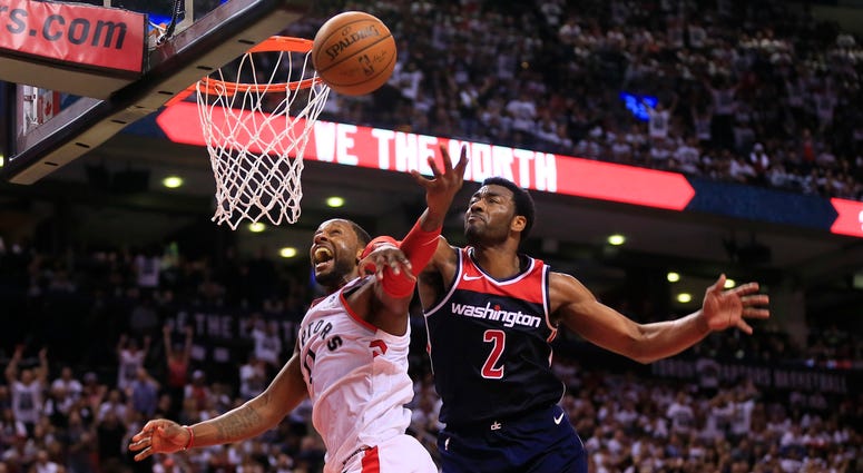 John Wall knocks the ball away from CJ Miles John_Wall_CJ_Miles