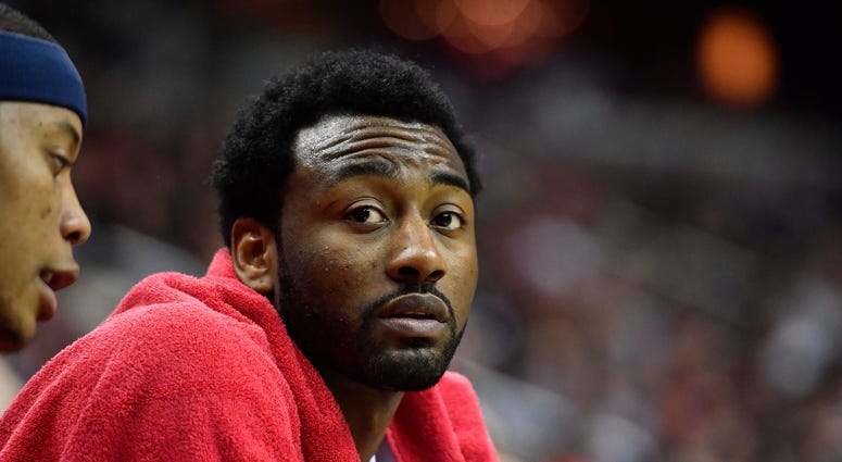 John Wall sitting on the bench. John_Wall