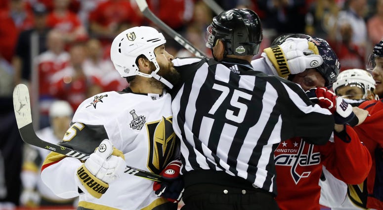 Deryk Engelland takes a jab at Nicklas Backstrom in the third period Deryk_Engelland_Nicklas_Backstrom