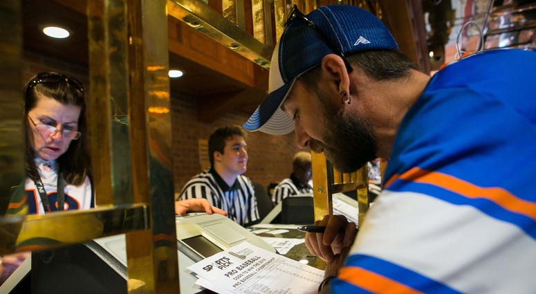 A fan places sports bets in Delaware. sports-betting