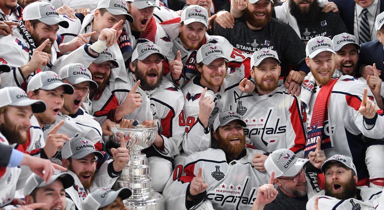 Top 10 D.C. Sports Moment: The Caps Stanley Cup win. Washington Capitals players pose for a team photo with the Stanley Cup