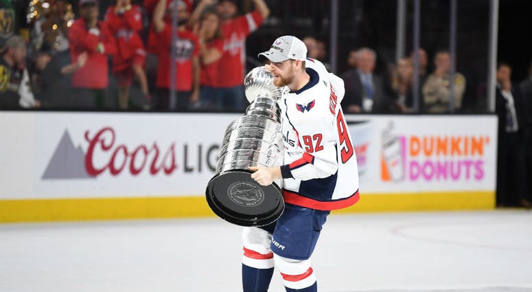 Capitals forward Evgeny Kuznetsov hold the Stanley Cup. Evgeny_Kuznetsov_Capitals