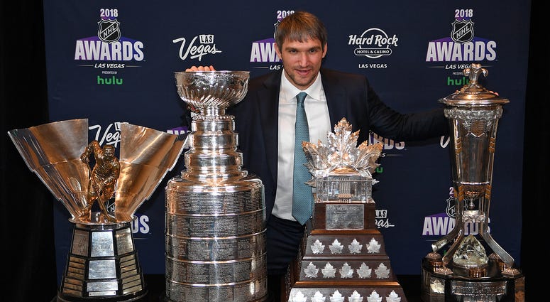 Ovi poses with the Stanley Cup, Rocket Richard, Conn Smythe and Wales trophies Alex_Ovechkin_NHL_Awards