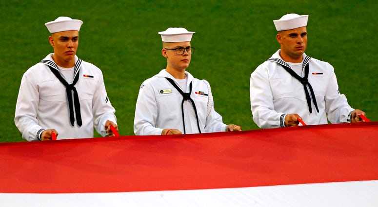 Sailors hold the American flag before the 2018 Home Run Derby miltiary_flag_nats