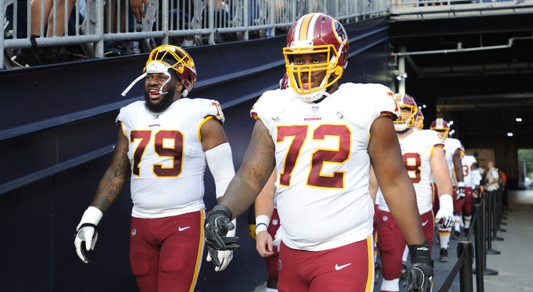 Redskins players walk out to the field prior to their first preseason game. Redskins_Preseason