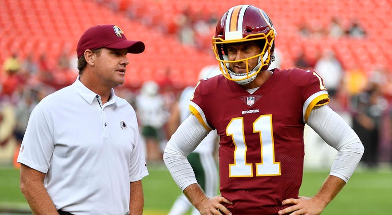 Jay Gruden confers with QB Alex Smith before a preseason game against the Jets Alex_Smith_Jay_Gruden