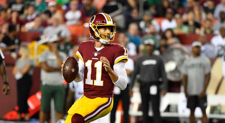 Alex Smith dropping back to pass. Alex_Smith