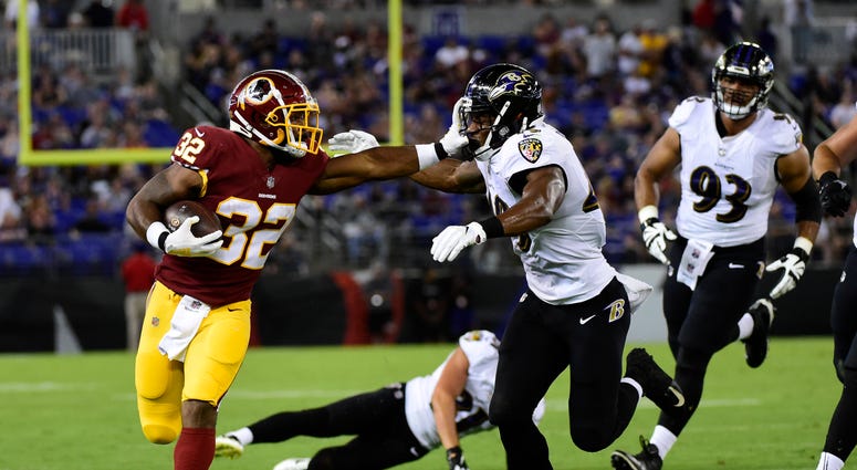 Samaje Perine stiff-arms a defender. Samaje_Perine
