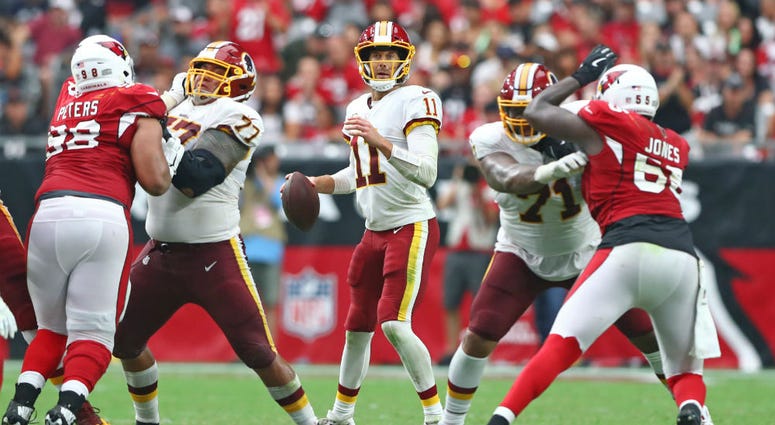 Alex Smith stands behind Redskins offensive line. Redskins_Offensive_Line