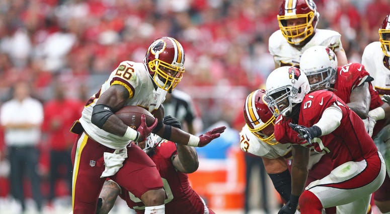 Adrian Peterson carries the ball for the Washington Redskins. Adrian_Peterson