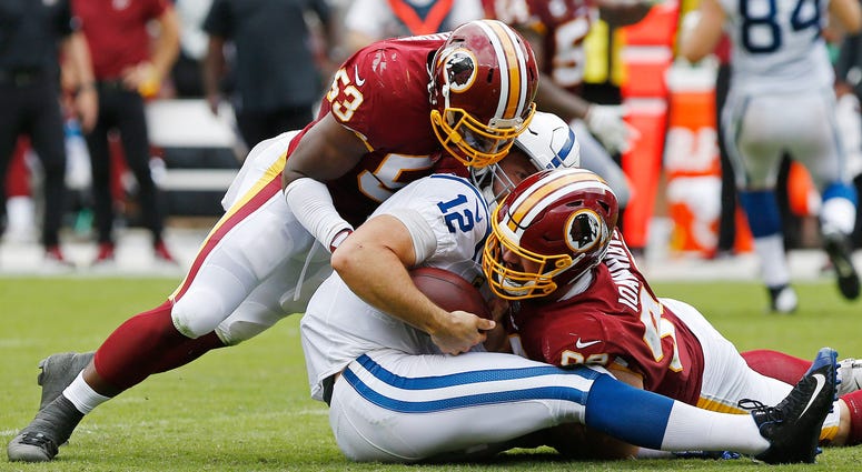 Redskins linebacker Zach Brown tackles Colts quarterback Andrew Luck. Zach_Brown_Andrew_Luck