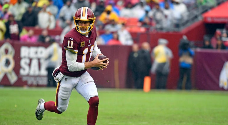 Alex Smith scrambles for a first down against the Packers Alex_Smith_Redskins_Packers