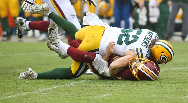 Clay Matthews sacks Alex Smith. Matthews was called for roughing the passer. Clay_Matthews_Alex_Smith