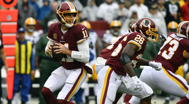 Redskins offensive line protects QB Alex Smith. Redskins_Offensive_Line