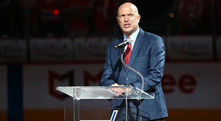 Capitals radio play-by-play announcer John Walton addresses the crowd. Local DC Sports Broadcasters launch initiative to help feed the city