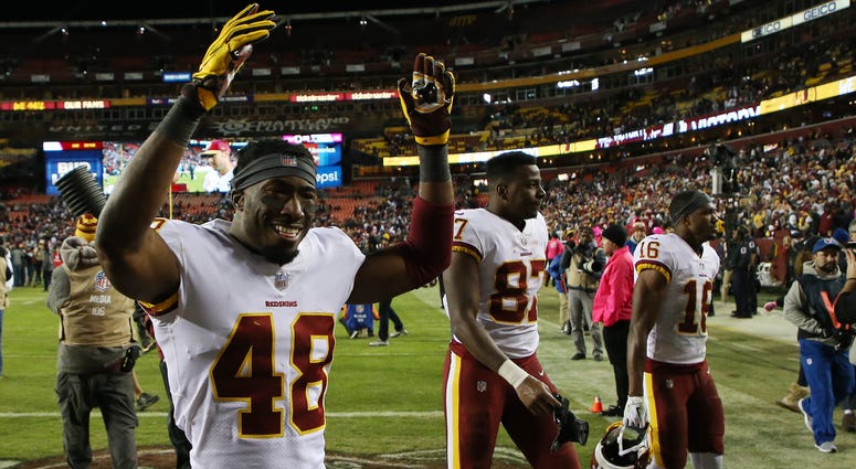 Young Redskins Kenny Ladler (48), Jeremy Sprinkle (87) and Jehu Chesson (16) walk off the field victorious over the Dallas Cowboys Kenny_Ladler_Jeremy_Sprinkle_Jehu_Chesson