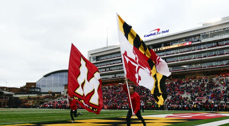 Maryland Terrapins cheer team celebrate after a score. University_Maryland_Football