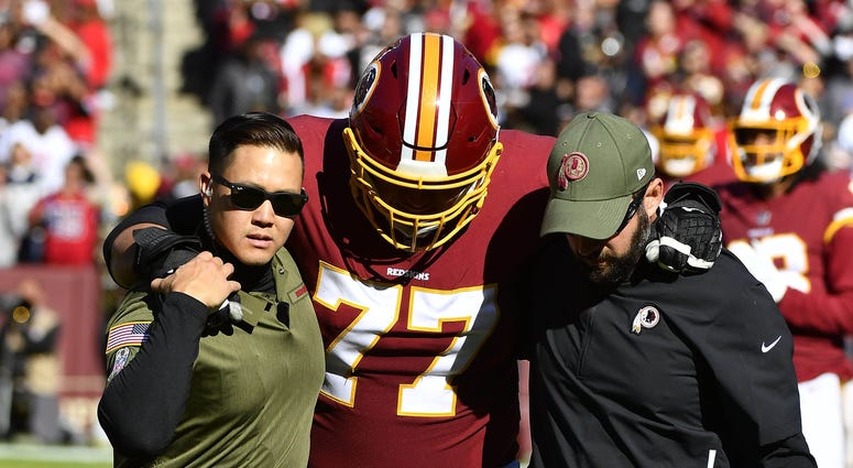 Shawn Lauvao helped off the field. Shawn_Lauvao_Injury