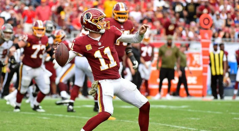 Redskins quarterback Alex Smith launches a pass. Redskins_Alex_Smith