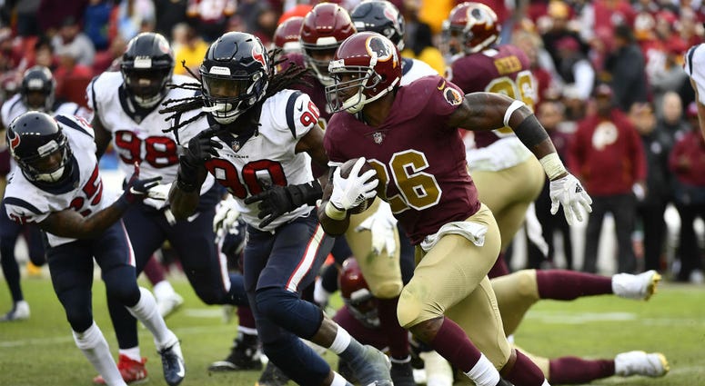 Redskins running back Adrian Peterson runs against the Texans. Adrian_Peterson_Redskins