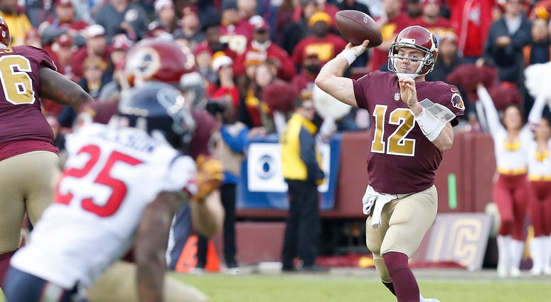 Colt McCoy throws the ball against the Texans in the fourth quarter Colt_McCoy_Redskins