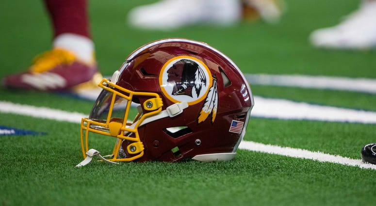 A Redskins helmet sits on the field before a Nov. 2018 game against the Cowboys Source: Redskins hire new executives in business office
